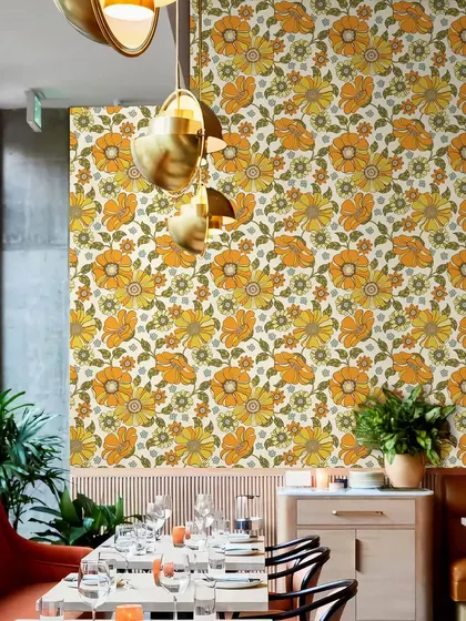 Our Crimson Daisies Floral Pattern wallpaper adds a vibrant and eclectic touch to this restaurant. The design is perfect for creating a lively and memorable dining experience.