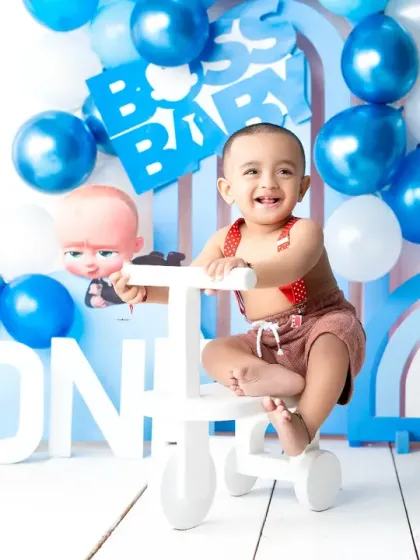 Full of smiles and energy, this little "Boss Baby" is ready to celebrate his first birthday. Themed milestone sessions are a fantastic way to capture your child's personality.