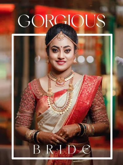 A gorgeous bridal portrait, capturing the bride's radiant smile and stunning traditional South Indian wedding look.