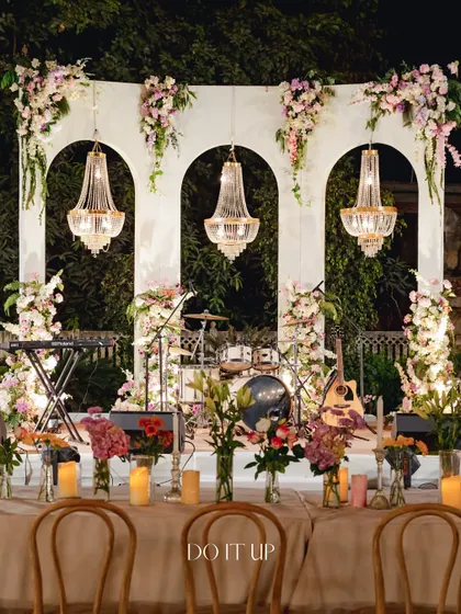 An elegant outdoor dinner in Jaipur. I used classic archways and crystal chandeliers to frame the stage, creating a sophisticated and timeless backdrop for an evening of live music and celebration under the open sky.