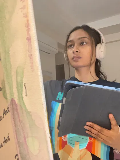The art I create is how I'm feeling or dreaming. It’s my way of channeling emotions and taking care of my heart. This is a quiet, reflective moment during my painting process, where I'm just listening to what the canvas needs.