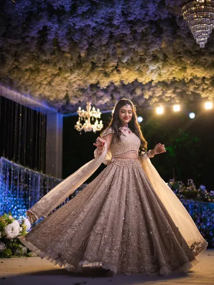Another joyful shot of Mahima twirling. Her makeup and entire look come together to create a picture of pure happiness and elegance.