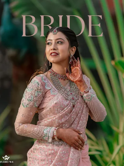 A stylish portrait of the bride in her pink reception saree, with the word "BRIDE" elegantly displayed.