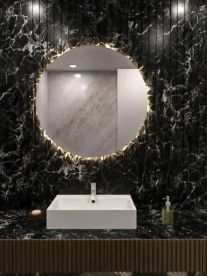 Another stunning bathroom concept, this time with dramatic black marble and a circular backlit mirror.