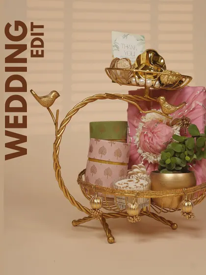 Presentation is everything to me. This elegant two-tiered golden stand is one of the many ways I package my wedding favors and return gifts, turning a simple thank you into a beautiful decorative piece.