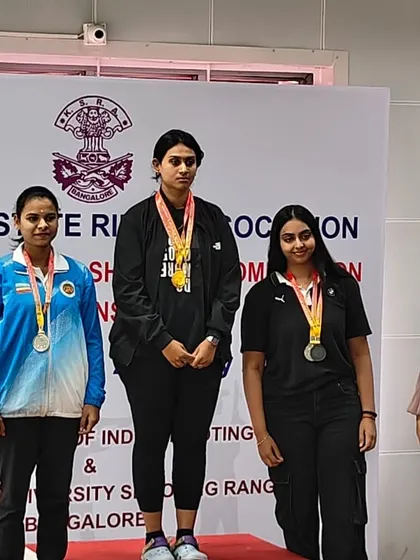 Shivani on the top of the podium after winning two Gold medals in the 25m Sports Pistol senior and junior women's events at the Karnataka State Competition.