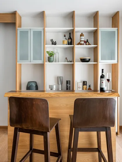 A full view of the 'Pepper and Coffee' bar unit, showcasing the asymmetrical shelving and warm wood tones.