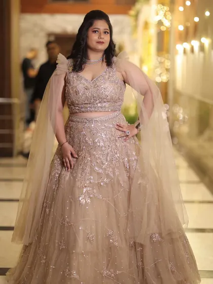 A stunning solo shot of Neelam at her reception. The glamorous makeup and beautiful gown come together for a show-stopping look.