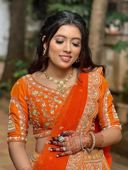 A close-up of the warm-toned eyeshadow and glowing skin.