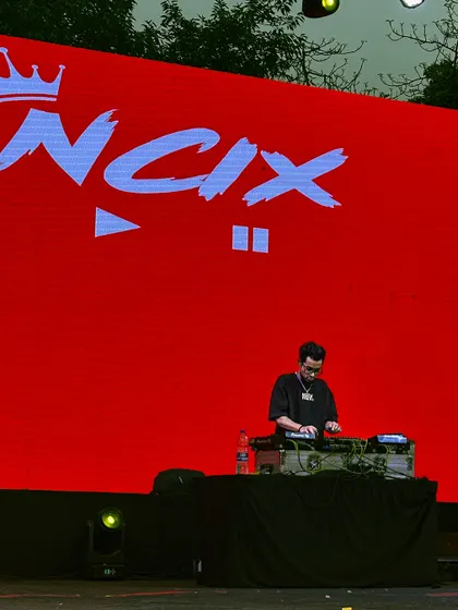 My name in lights on the big screen at Ramjas College, Delhi University. I provide custom visuals and branding for my sets to create a professional and immersive concert experience.