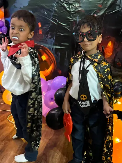 Don't mess with this spooky duo! A little vampire and his friend are ready for action with their capes, fangs, and cool skull-themed accessories.