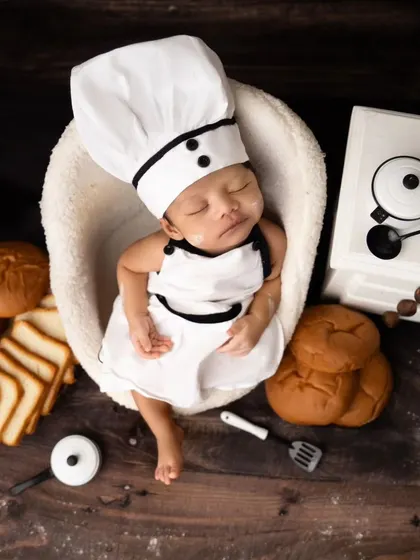 Meet the tiniest chef in town! This adorable chef-themed newborn shoot is perfect for foodie families, featuring a miniature chef's hat, apron, and bakery props.