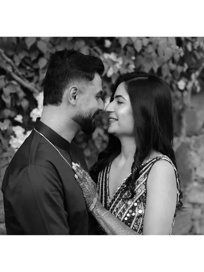 A classic black and white close-up, capturing the couple's loving gaze and the timeless beauty of their connection.