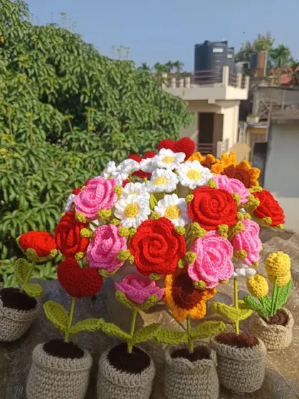 Another view of the mixed flower arrangement, showing how potted plants can be combined with bouquets.