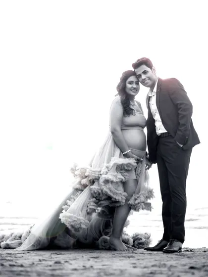 A beautiful black and white version of a beach portrait. Stripping away the color focuses the attention on the couple's expressions and the dramatic silhouette of the gown.
