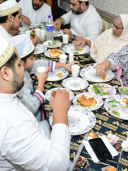 A family enjoying their meal in the traditional Bohra style. We ensure an authentic experience for all our guests.