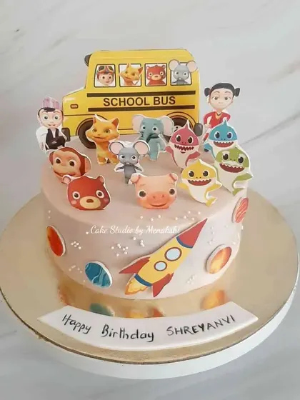 A fun birthday cake for a child who loves all their cartoon friends. This design features characters from Baby Shark, the school bus song, and more.