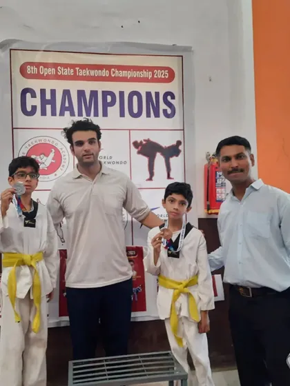Two of my students on the podium with their medals. Their hard work and training paid off.