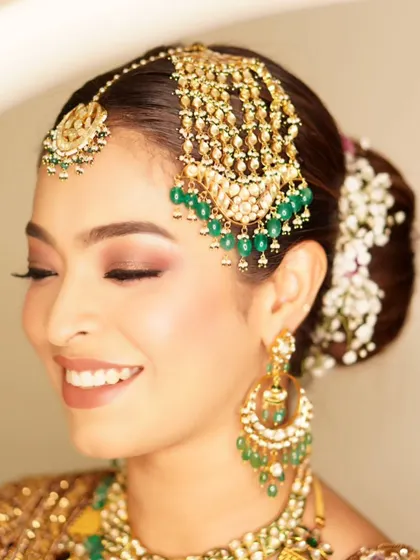 A radiant look for the groom's sister, Gazala. We created a beautiful smokey eye with a touch of glitter that made her eyes the star of the show.