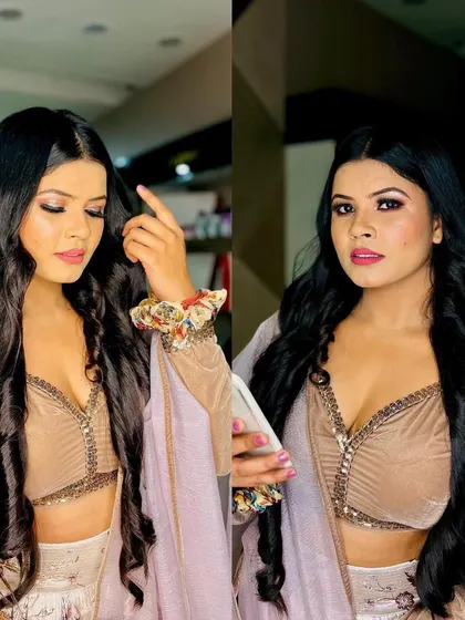 A glamorous party look with long, flowing waves and a sultry smoky eye. This client is ready to turn heads at her event.