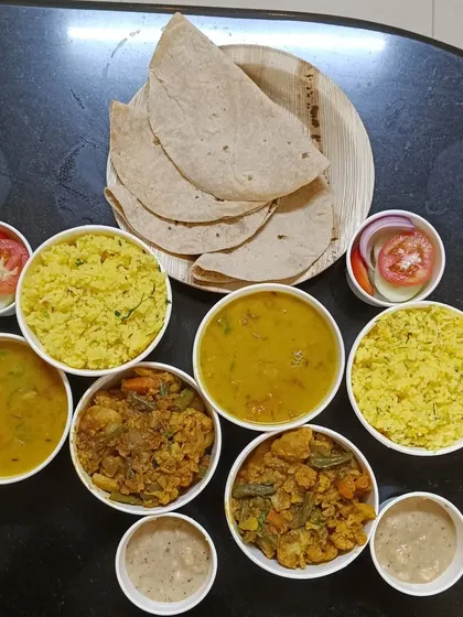 Our trial meals are all set for dispatch. This is a great way for you to sample our food before placing a large order for your party or office. This spread includes lemon rice, mixed vegetable curry, dal, and rotis.