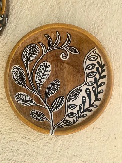 A close-up of one of the black and white botanical plates. The intricate patterns within the leaves give it a unique, illustrative quality against the rustic wood grain.