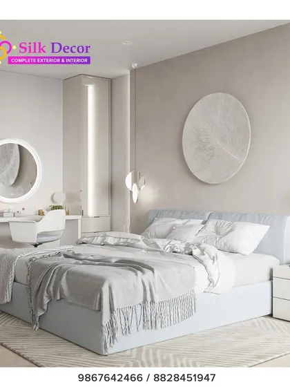 This serene bedroom features one of our simple, light blue upholstered beds. The clean lines and understated design create a calm and airy feel, proving that luxury can also be found in simplicity. The bed is paired with a custom white vanity set.