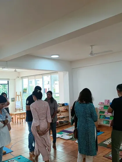 Parents observing the different learning stations during the 'Elementary-Ready' orientation.