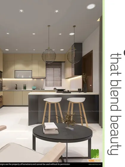 An open-concept kitchen featuring an island with a breakfast counter. The two-tone cabinets and pendant lighting over the island make this a social and inviting space, perfect for modern living.