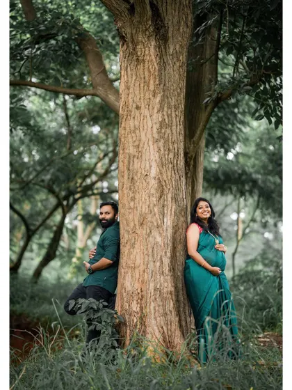 This image embodies our candid, nature-focused approach. We found a serene spot in a Bangalore forest, allowing the couple to relax and connect naturally, resulting in an authentic and peaceful maternity portrait.