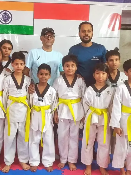 Our new yellow belts, proud and excited to have passed their first major test in Taekwondo.