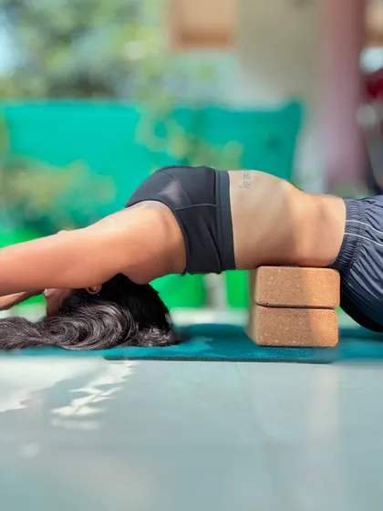 Using two yoga blocks to support my upper back in a supported fish pose. This is one of my favorite ways to open my chest and shoulders, especially after a long day. It encourages deep, relaxing breaths.