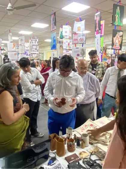 A bustling scene from our student exhibition, where guests and students interact and discuss the various design projects on display.