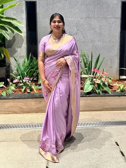 Our client looking serene and beautiful in her lilac pure Mysore crepe saree with cutwork embroidery.