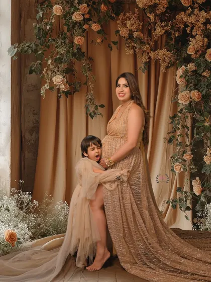A candid and playful moment between a mother and her son during her maternity shoot. These genuine interactions make for the best memories.