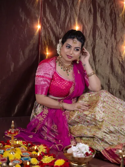A festive shot from my Diwali-themed photoshoot. The model is surrounded by diyas, and her makeup is warm and celebratory, reflecting the spirit of the festival.