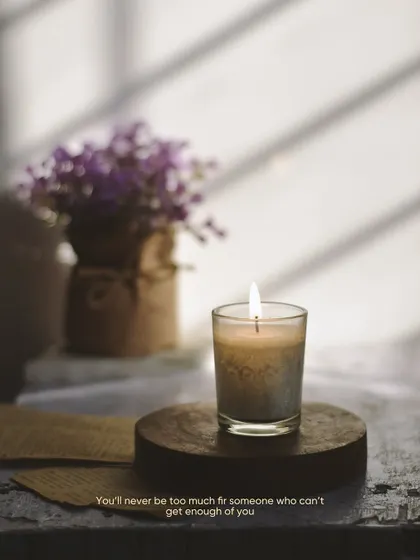 A quiet moment with a lit candle and a vase of flowers, illuminated by soft window light. This kind of still life photography is like meditation for me, focusing on light, shadow, and mood.