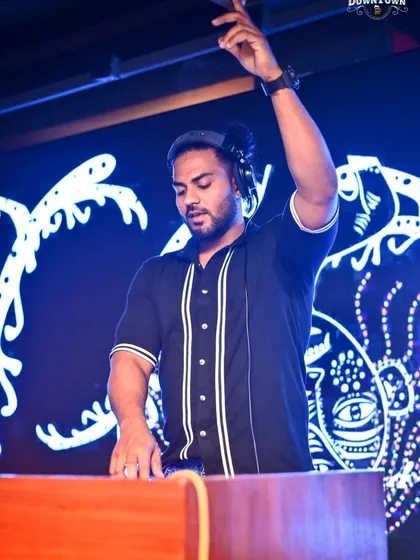 Take only memories, leave only footprints. A shot of me at the decks, with my hand in the air, feeling the music and sharing that feeling with everyone in the room.