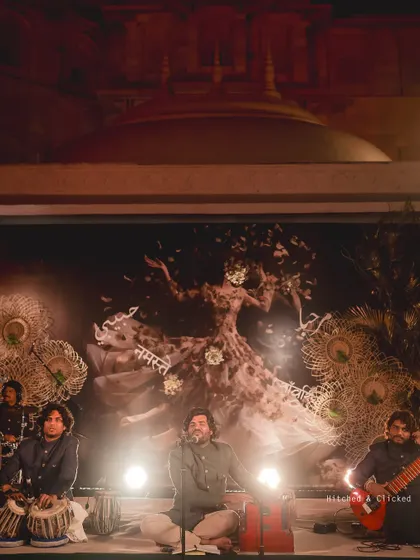 A live Sufi band performs on a stage with a beautiful, artistic backdrop. We curate entertainment that perfectly matches the mood and theme of each function.