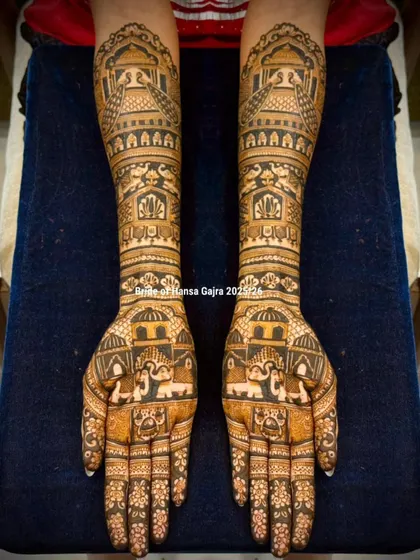 An architecture-inspired bridal design. The arms are adorned with patterns resembling royal domes and arches, creating a unique and majestic look that stands out.