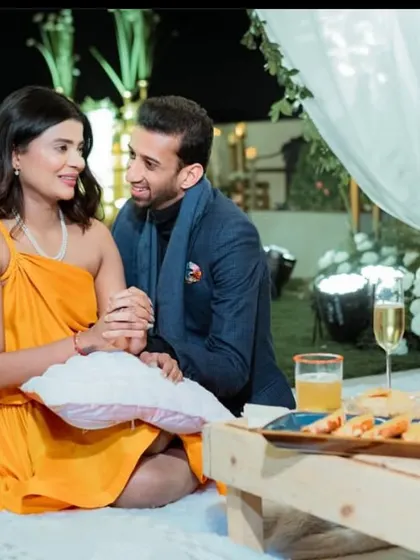 It's not just about the big moment, but the quiet ones that follow. We create cozy, intimate picnic setups for after the proposal, complete with comfortable seating, champagne, and a curated cheese board.