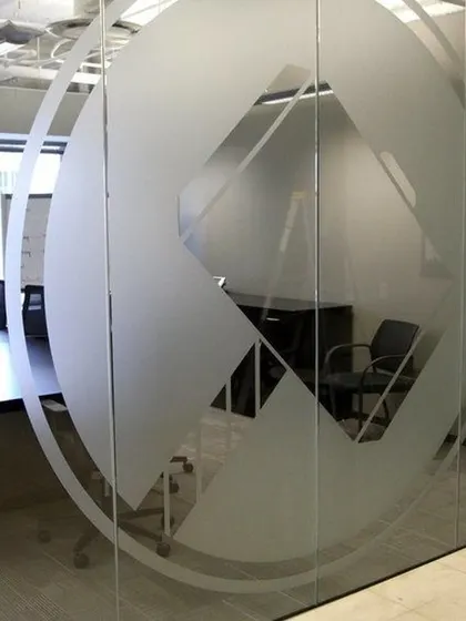 A repeated view of a custom logo frosted film, perfect for reinforcing branding in a corporate environment.