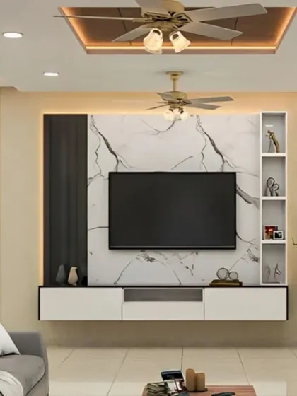 This TV unit combines a marble-look back panel with dark and light laminates for a modern, high-contrast look. The open shelving is perfect for displaying decor.