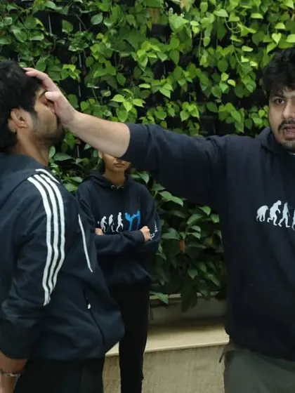 In Krav Maga, we say if you find yourself in a fair fight, your tactics are wrong. Here, I am demonstrating how to use a simple eye poke to create an opening and disrupt an attacker's ability to fight back.