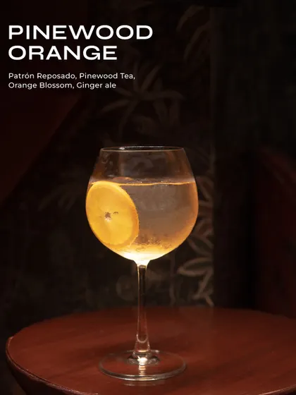 The Pinewood Orange, an earthy and citrusy highball with Patrón Reposado and pinewood tea.