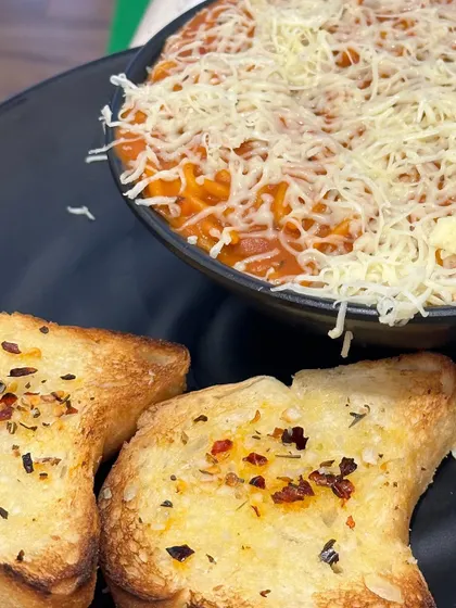 My Red Sauce Spaghetti Pasta is a classic Italian dish done right. It's tangy, flavourful, and topped with a generous amount of cheese.