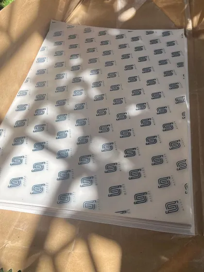 This is custom-designed wrapping paper I created for the clothing label, @_labelmysha_. The sunlight shows off the clean, repeating logo pattern.
