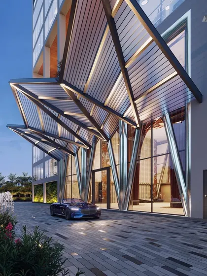 The dramatic entrance canopy of the Narmada commercial building. This feature creates a grand sense of arrival, welcoming users into a space where business and nature coexist.
