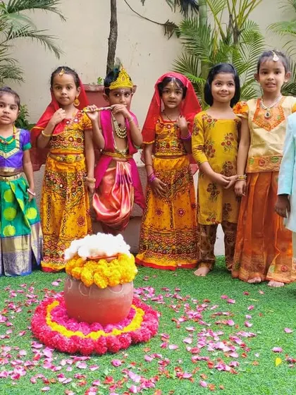 Our entire group of little Krishnas and Radhas posing together during the Janmashtami festival. A beautiful picture of cultural immersion and fun.