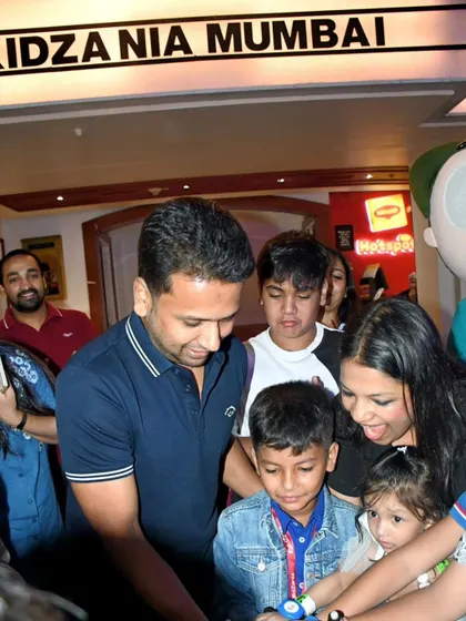 A candid shot of the cake cutting ceremony at Kidzania Mumbai. The cricket stadium cake was a huge hit with all the kids.
